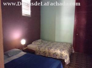 2 cameras beds in room with window air