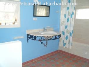 Spacious bathroom with hot water