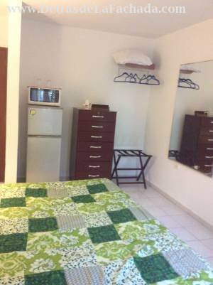 Room with green bathroom