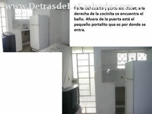 Part of the bedroom and the kitchen