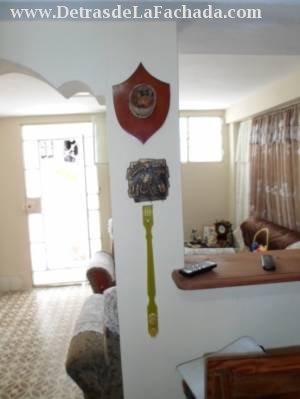 THE DOOR OF THE HOUSE AND PART OF THE ROOM