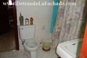 Bathroom sandwiched between the two quarters