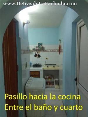 Hall toward the kitchen between bath and room