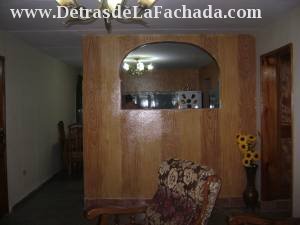 VIEW OF LIVING ROOM AND KITCHEN ENTRANCE