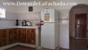 Vista de la Cocina de la casa enfocada hacia sala