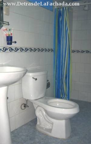 Spacious bathrooms with pedestal sinks