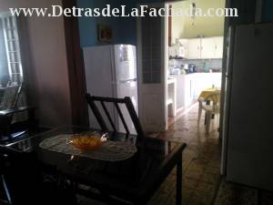Dining room and access to the kitchen door.