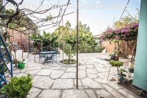 Flagstone courtyard / Patio of the service left